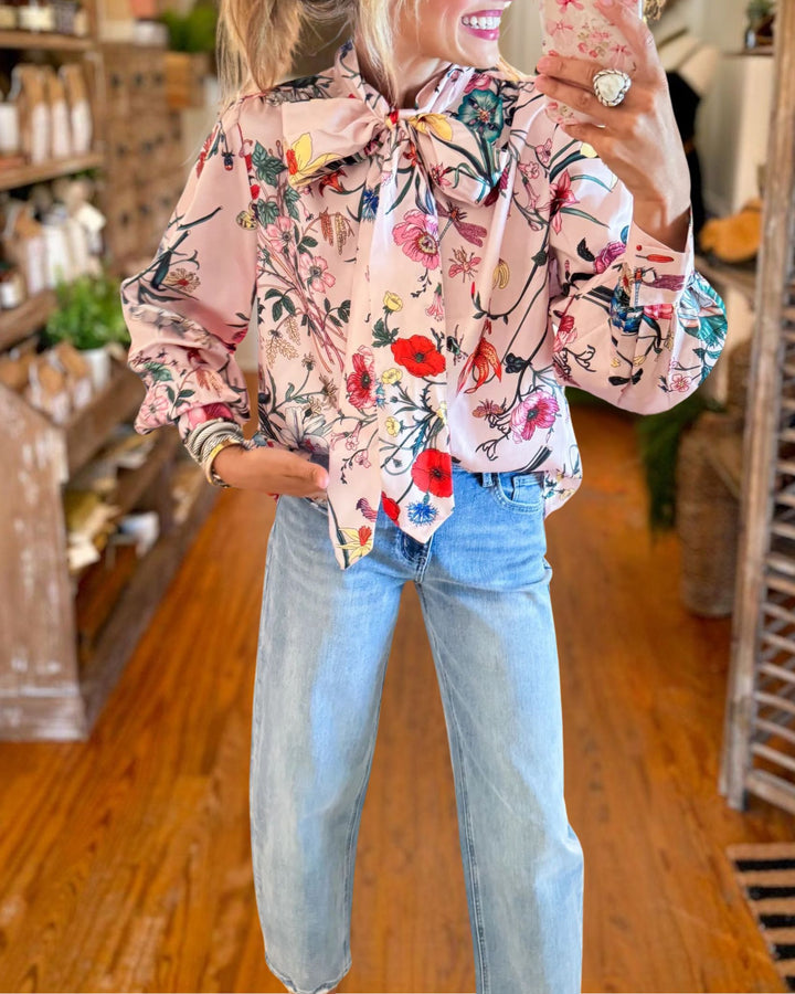 Pink floral bow neck blouse detail view